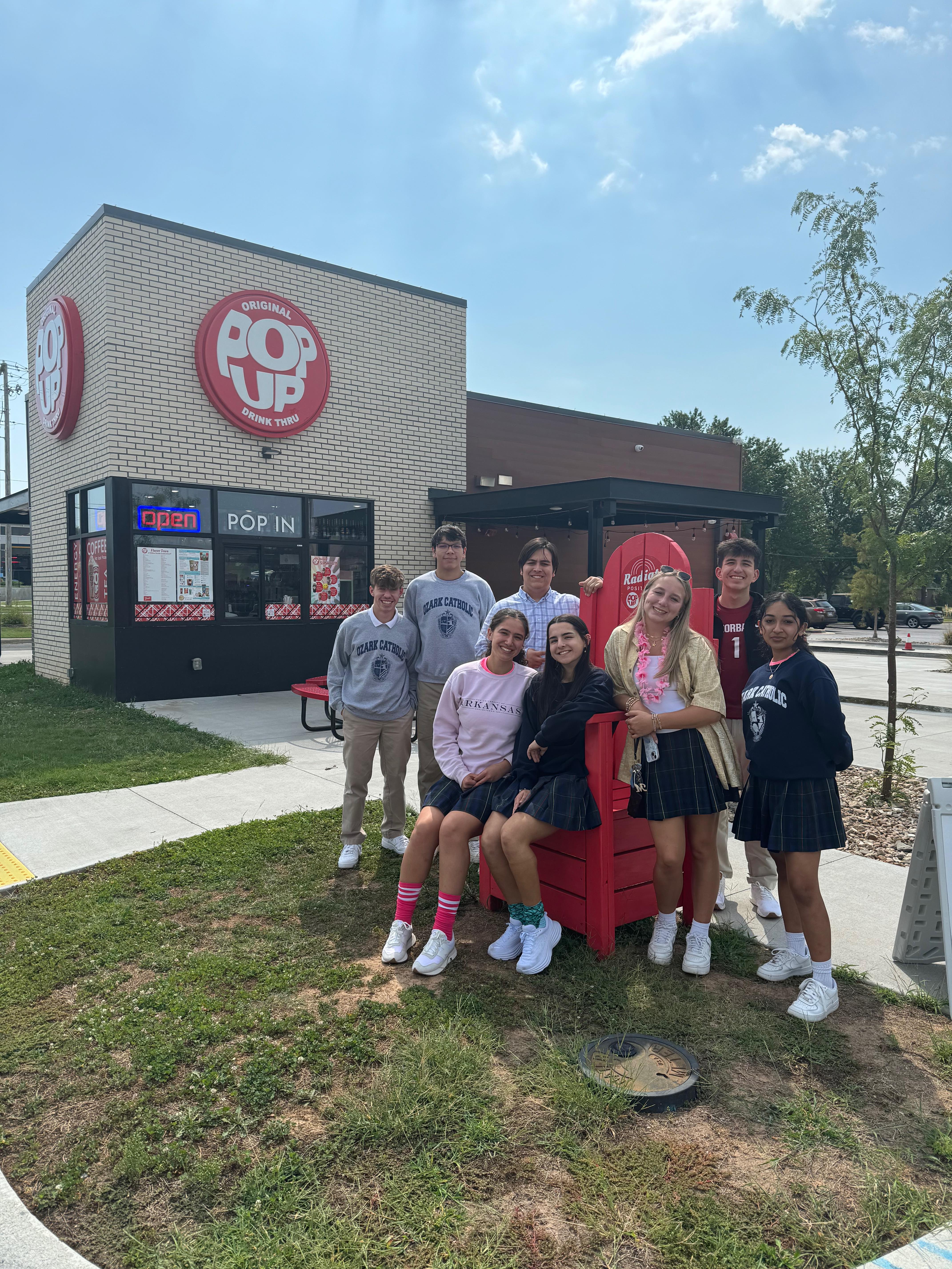 Students and teachers celebrating PopUp Entrepreneurship business success at school